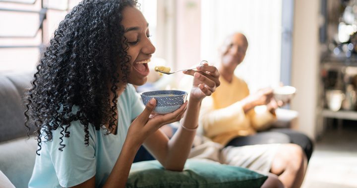 a person eating soup