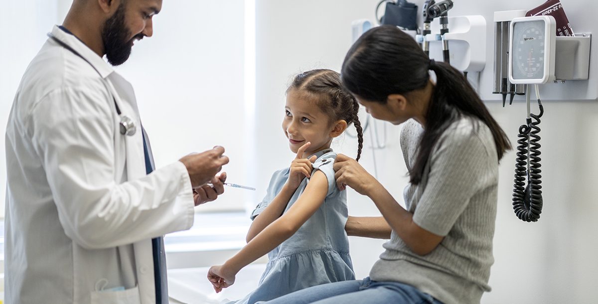 a kid getting their flu shot